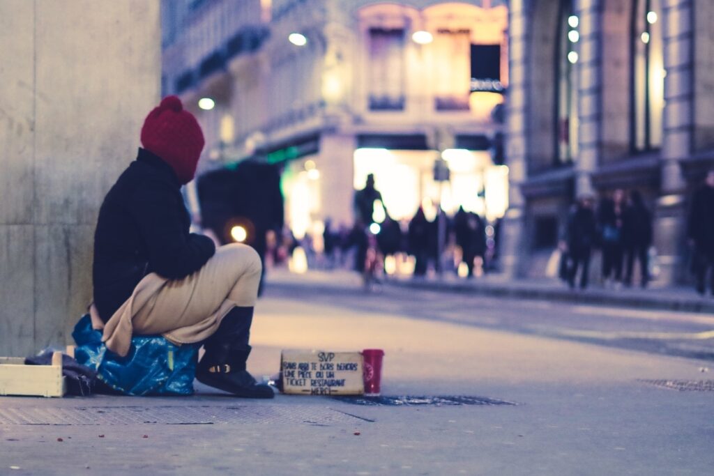 homeless man on street corner