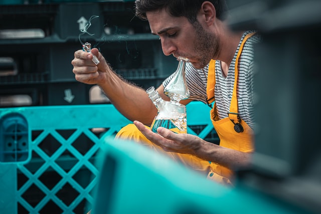 man smoking a clean bong 