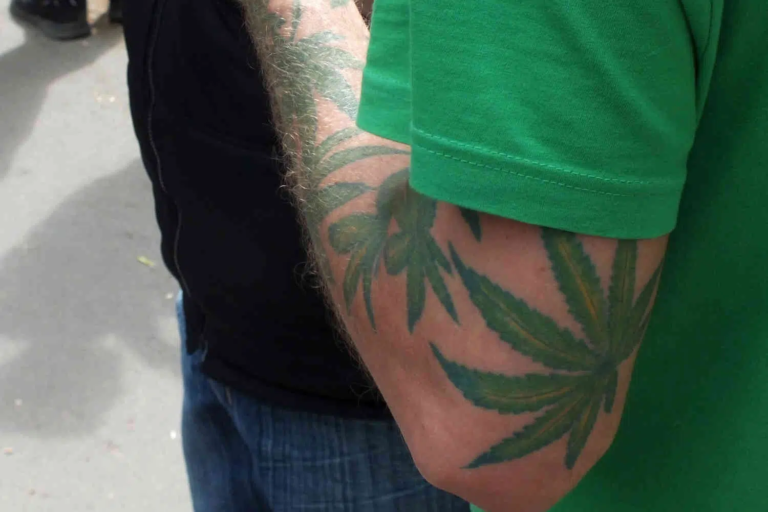 Man displays his new school stoner tattoo sleeve
