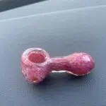 mini pipe made of red colored glass