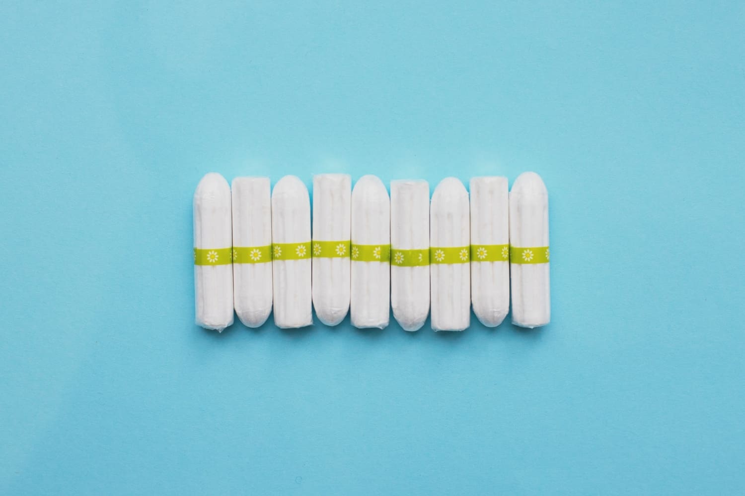nine tampons against a blue background