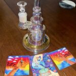 iridescent dab rig with stickers on table