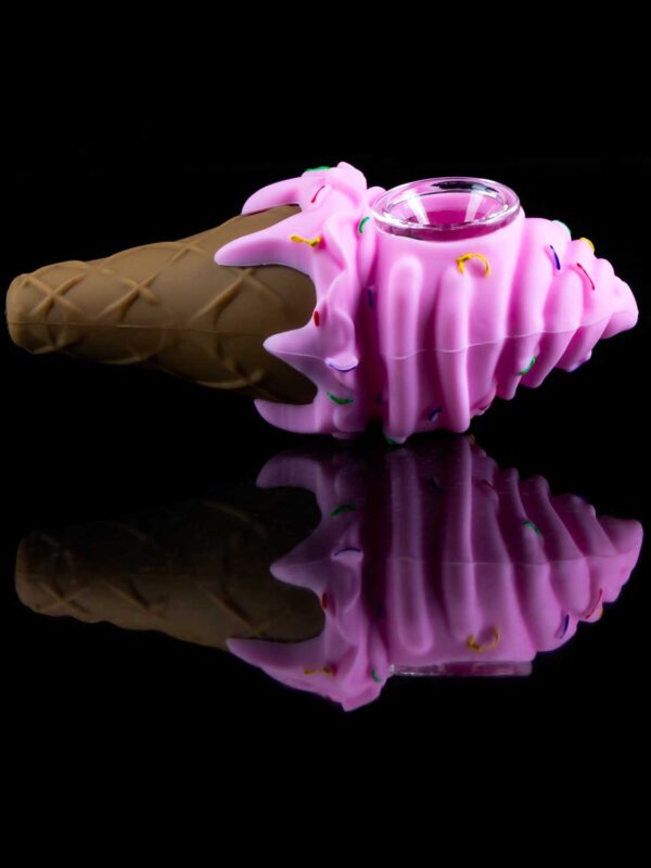 ice cream cone pipe in strawberry color on black table