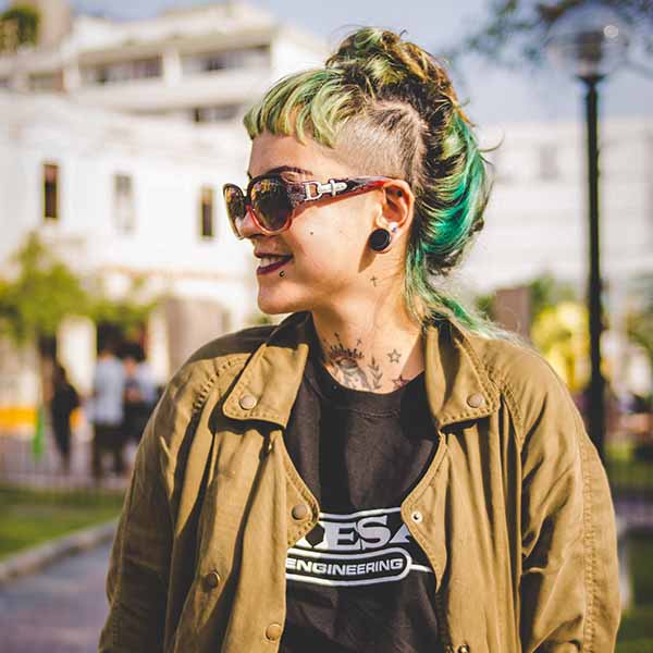 cool girl with partially buzzed green hair