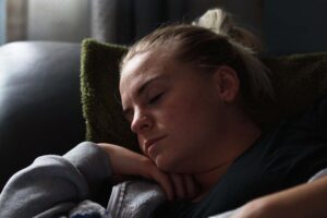 girl sleeping on couch after smoking weed