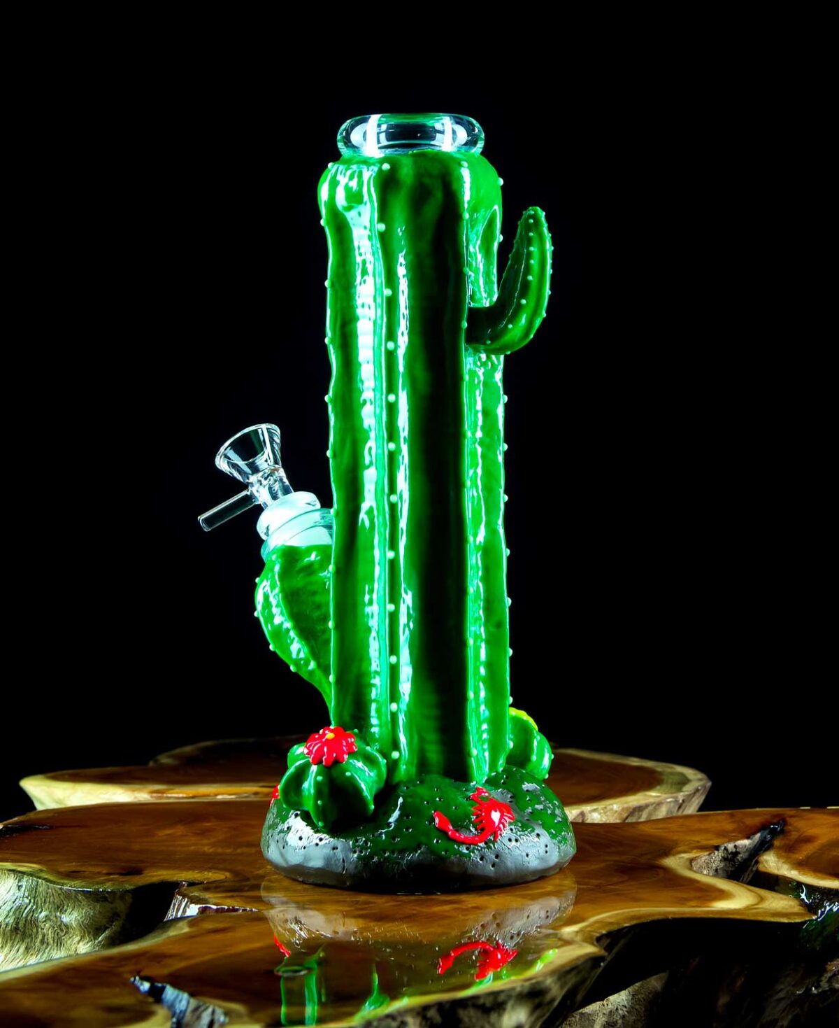 cactus bong that glows in the dark on wooden table