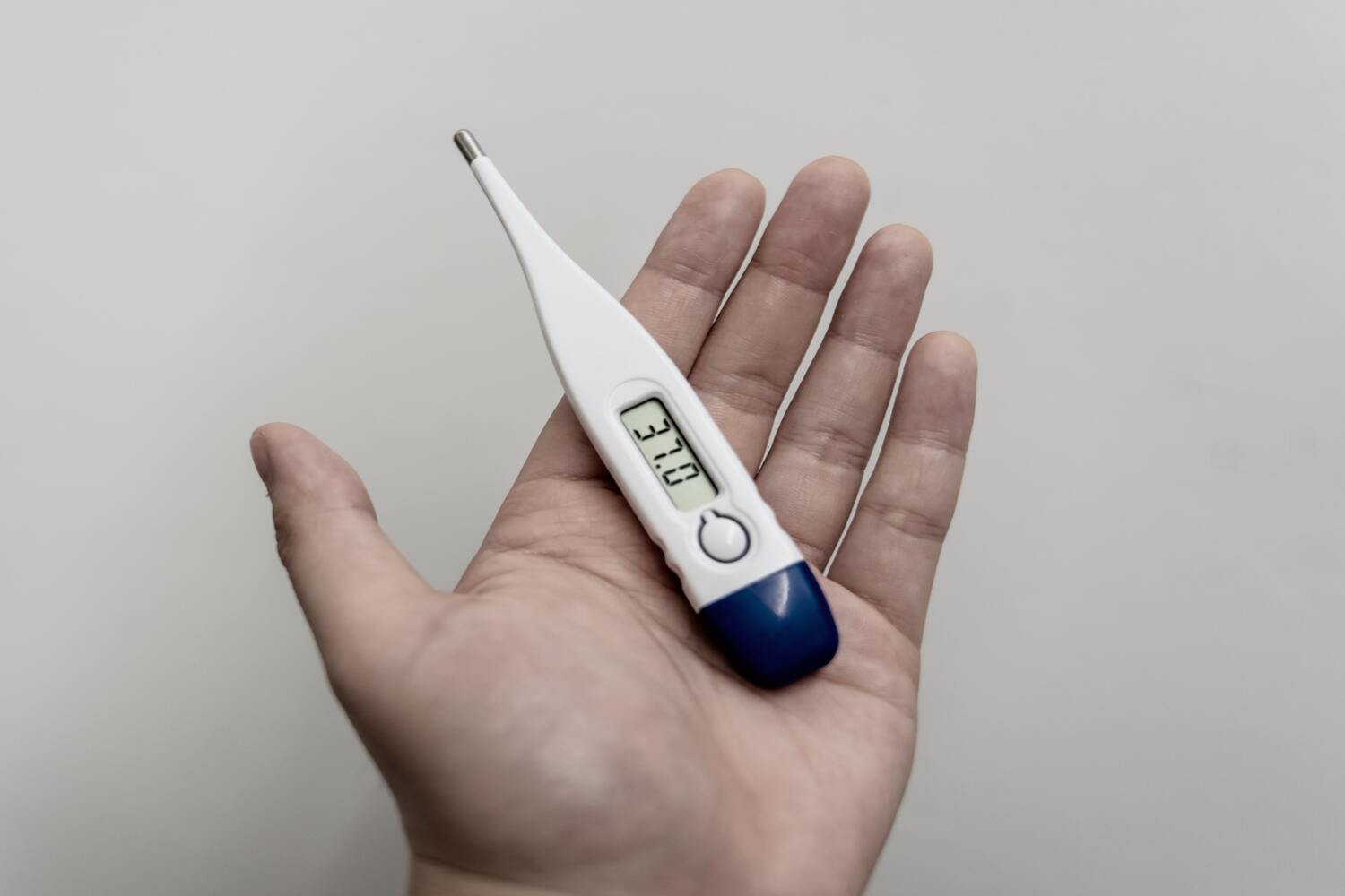thermometer showing a fever