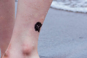 Rose ankle tattoo