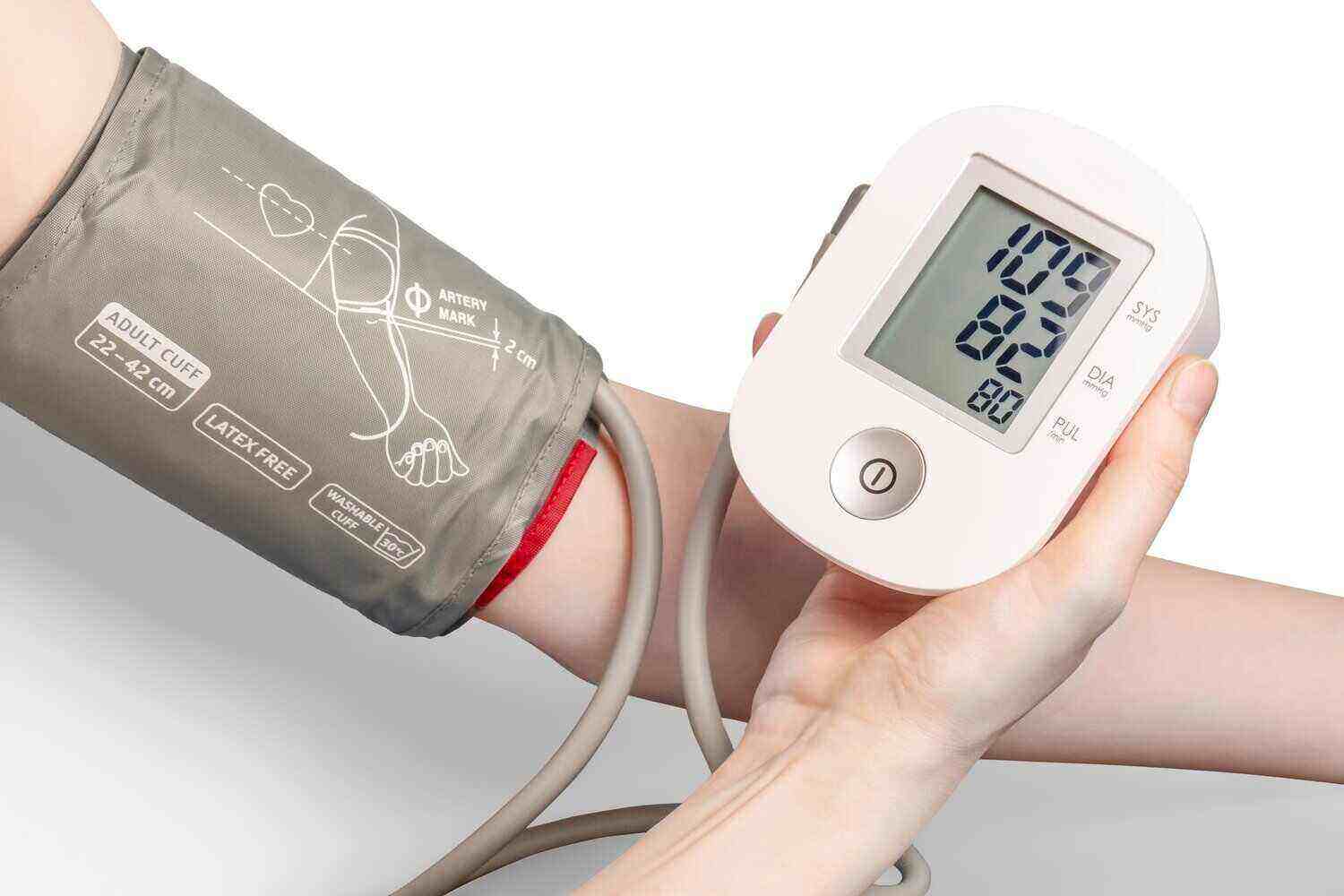 blood pressure machine checking someone's blood pressure