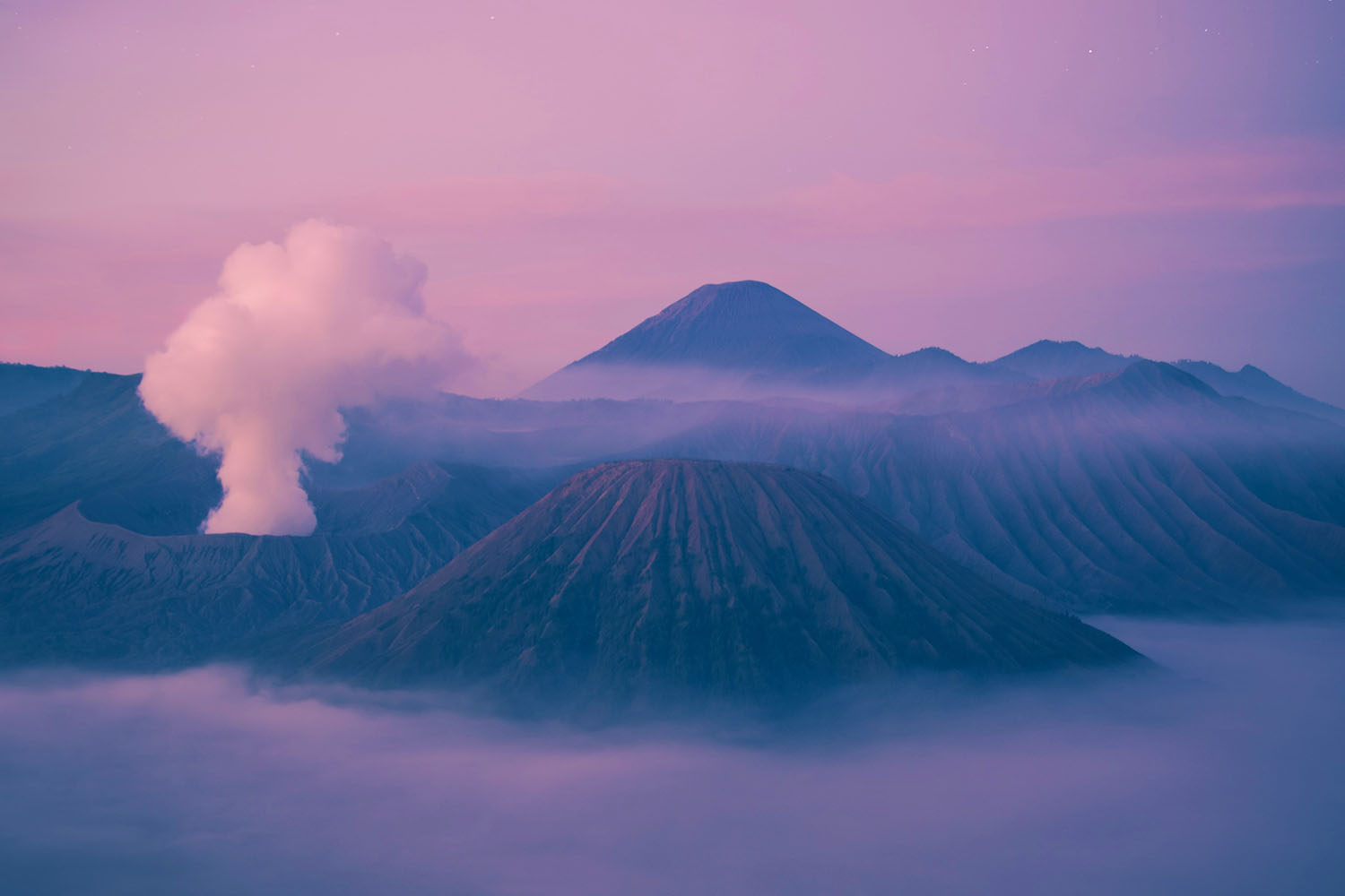 volcano with purple sky and clouds