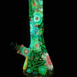 glow in the dark bong with flowers and weed leaves