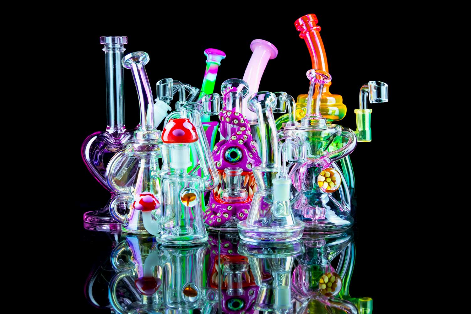 pink dab rig collection with reflection on black table
