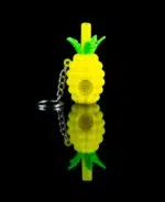pineapple keychain pipe with glass bowl on black table