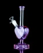 lavender heart bong with glass bong bowl on black table