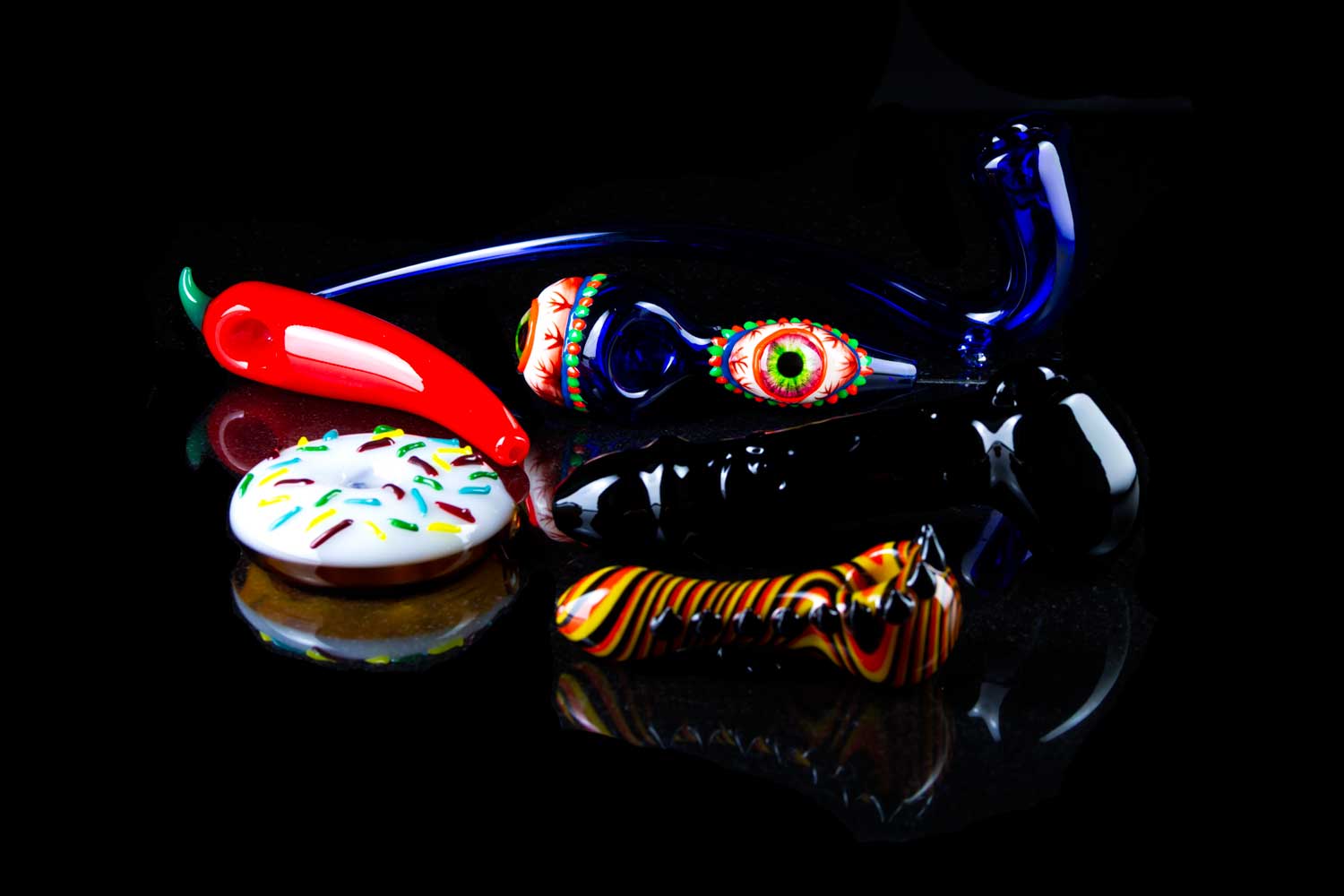 unique glass pipes on black table