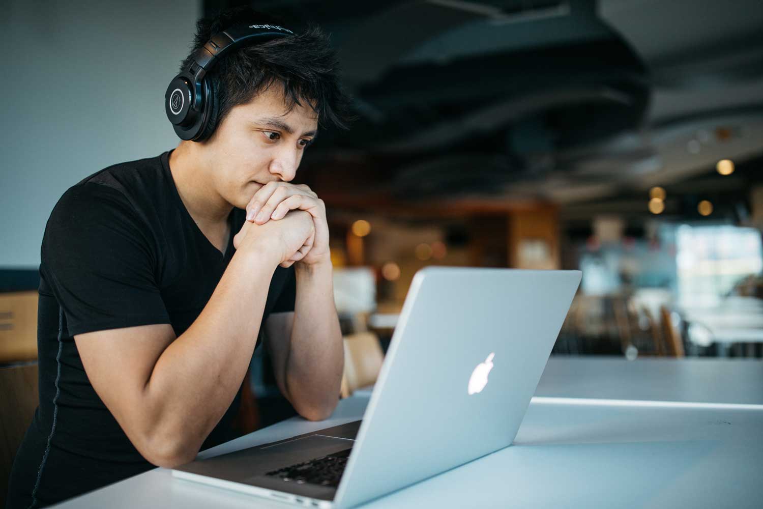 man trying to focus on work on computer