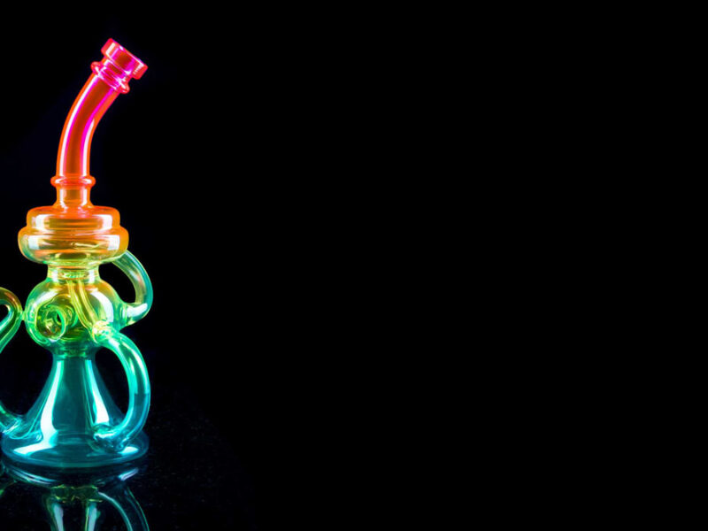 rainbow recycler rig on black background