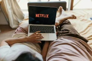 couple watching netflix in bed