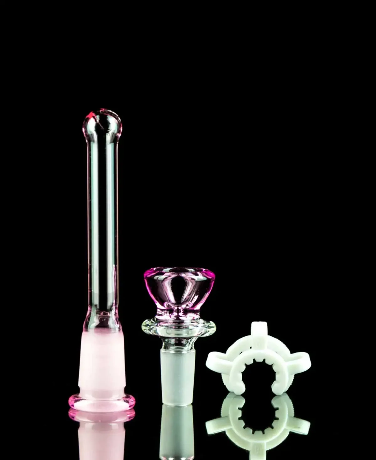 hello kitty bong accessories on black table