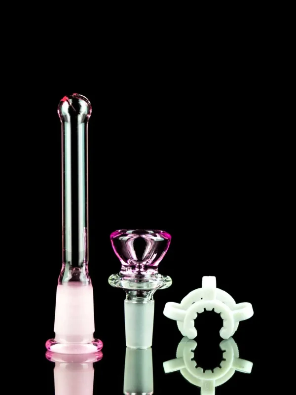 hello kitty bong accessories on black table
