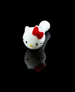 hello kitty pipe on black table