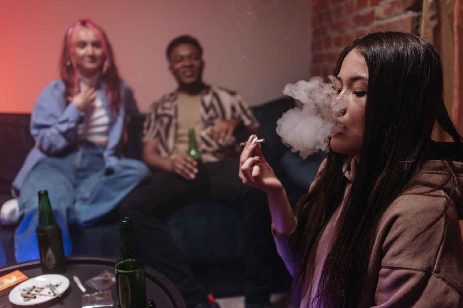 a group of young people smoking weed