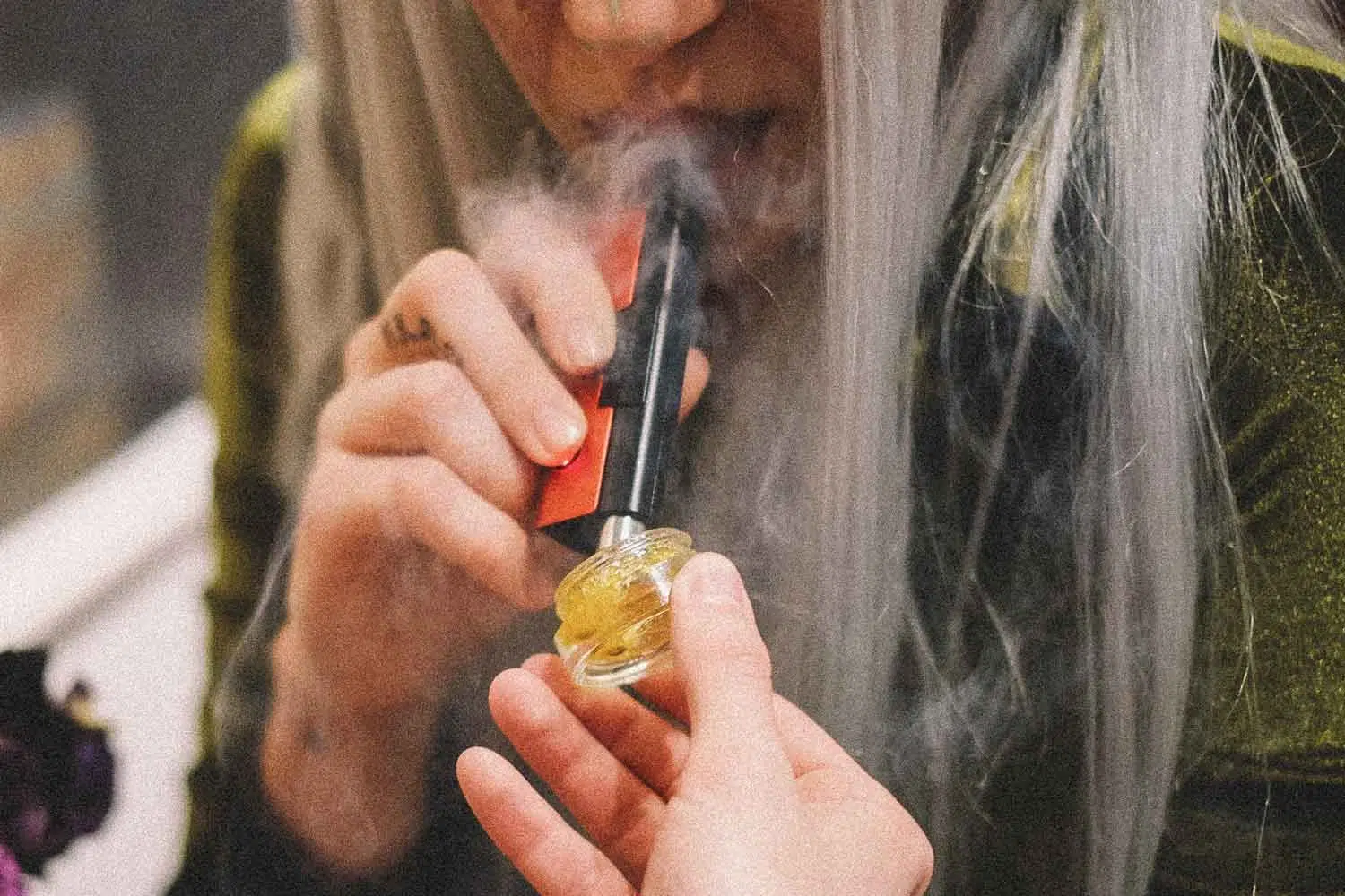 woman smoking a dab