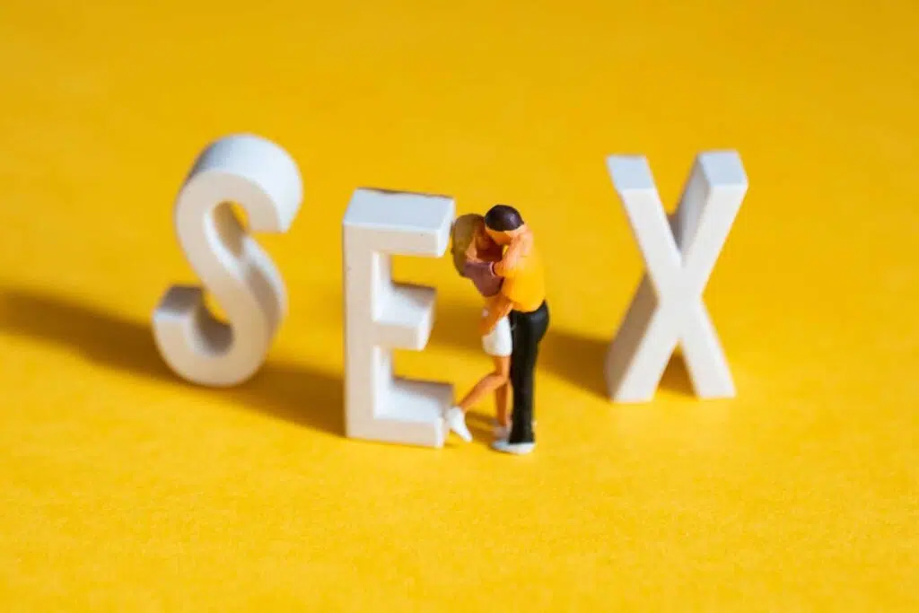 sex letters with two figurines kissing