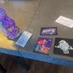 monster bong on table with stickers