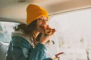 woman eating pizza