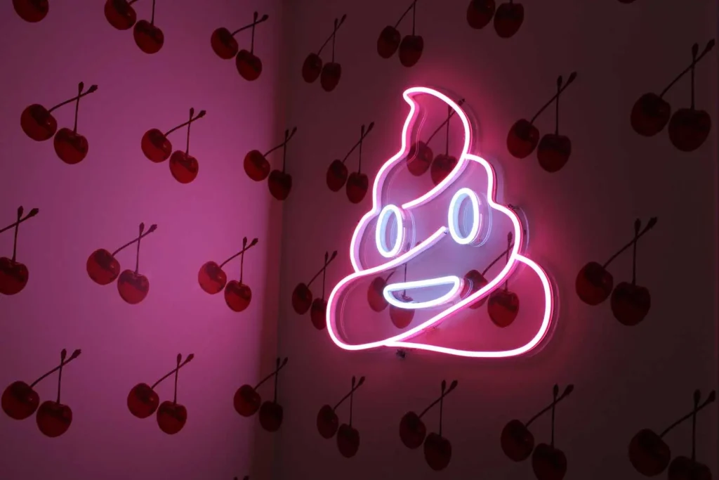 poop emoji light with cherry wallpaper
