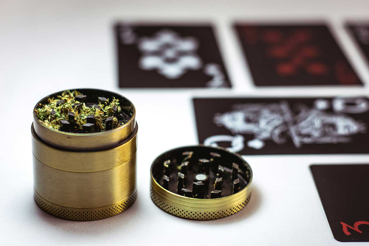 gold weed grinder on table